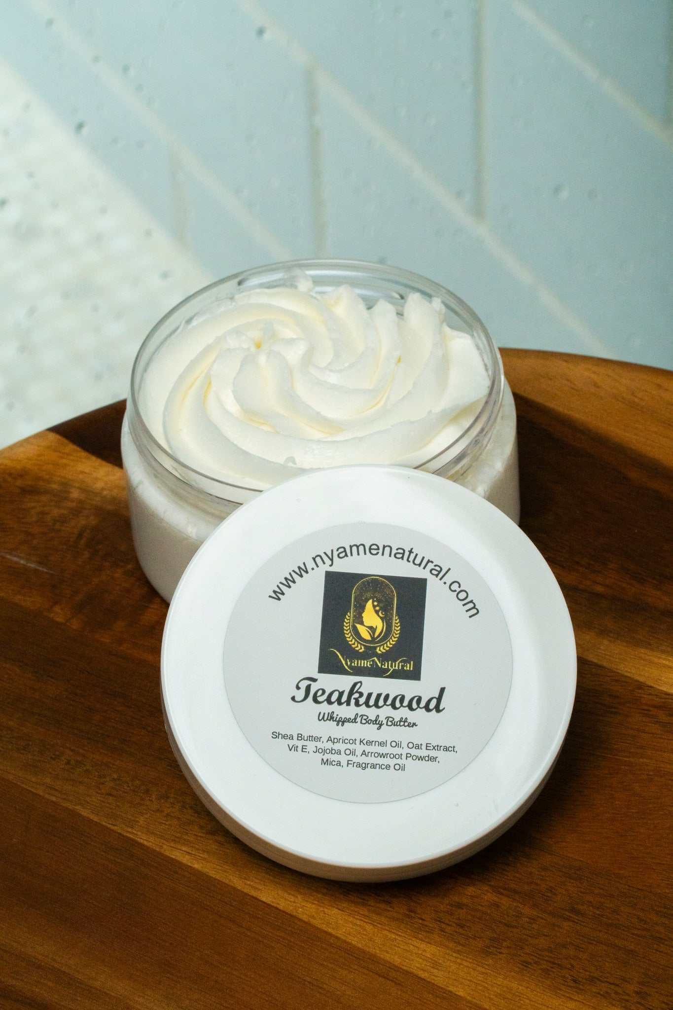 Teakwood body butter in a jar, showcasing silky texture and nourishing ingredients like shea butter and jojoba.