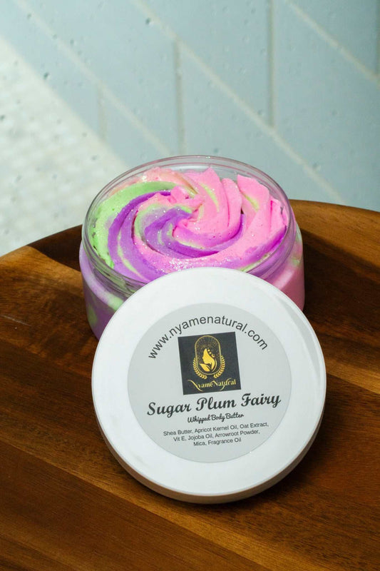 Luxurious Sugar Plum Fairy Body Butter with colorful swirls in jar, perfect for nourishing and pampering skin.