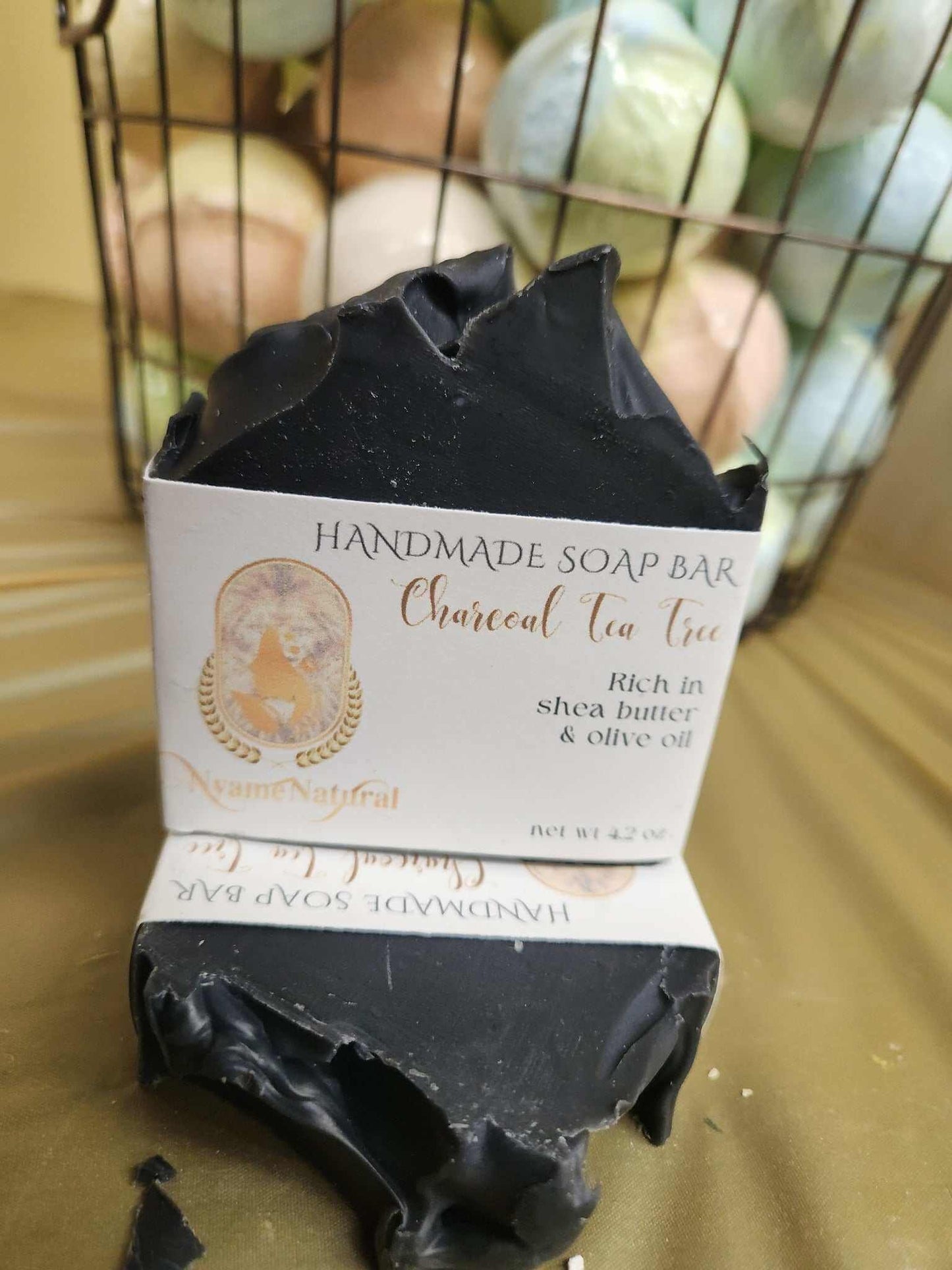 Handmade Charcoal Tea Tree soap bar rich in shea butter and olive oil for deep moisture and rejuvenating skin care.