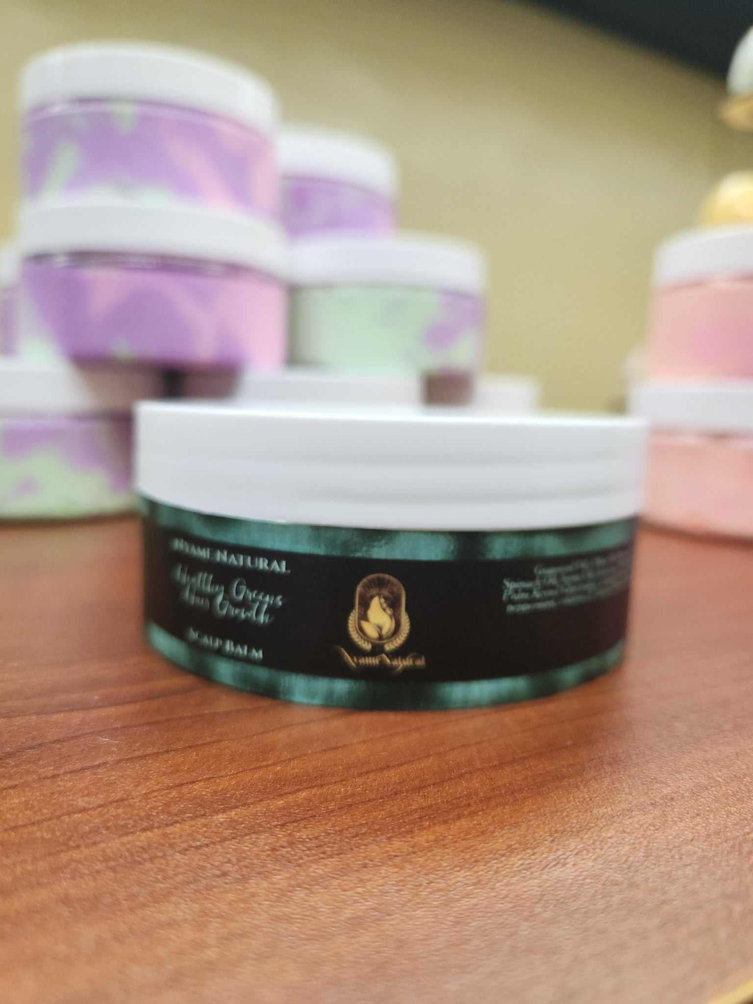 Healthy Green Scalp Balm jar showcasing hemp seed oil benefits for moisturizing and promoting hair growth.