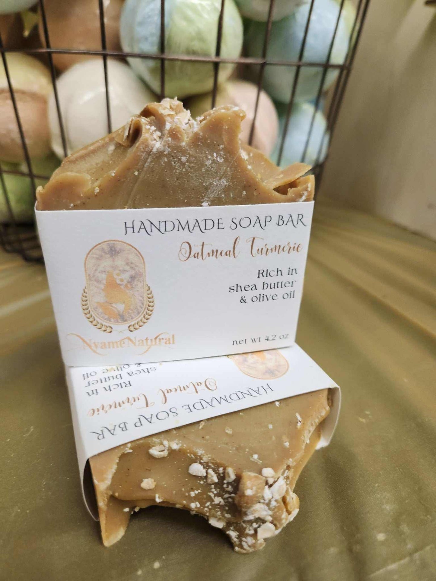 Handmade Turmeric & Oat Meal soap bar, rich in shea butter and olive oil, displayed elegantly.
