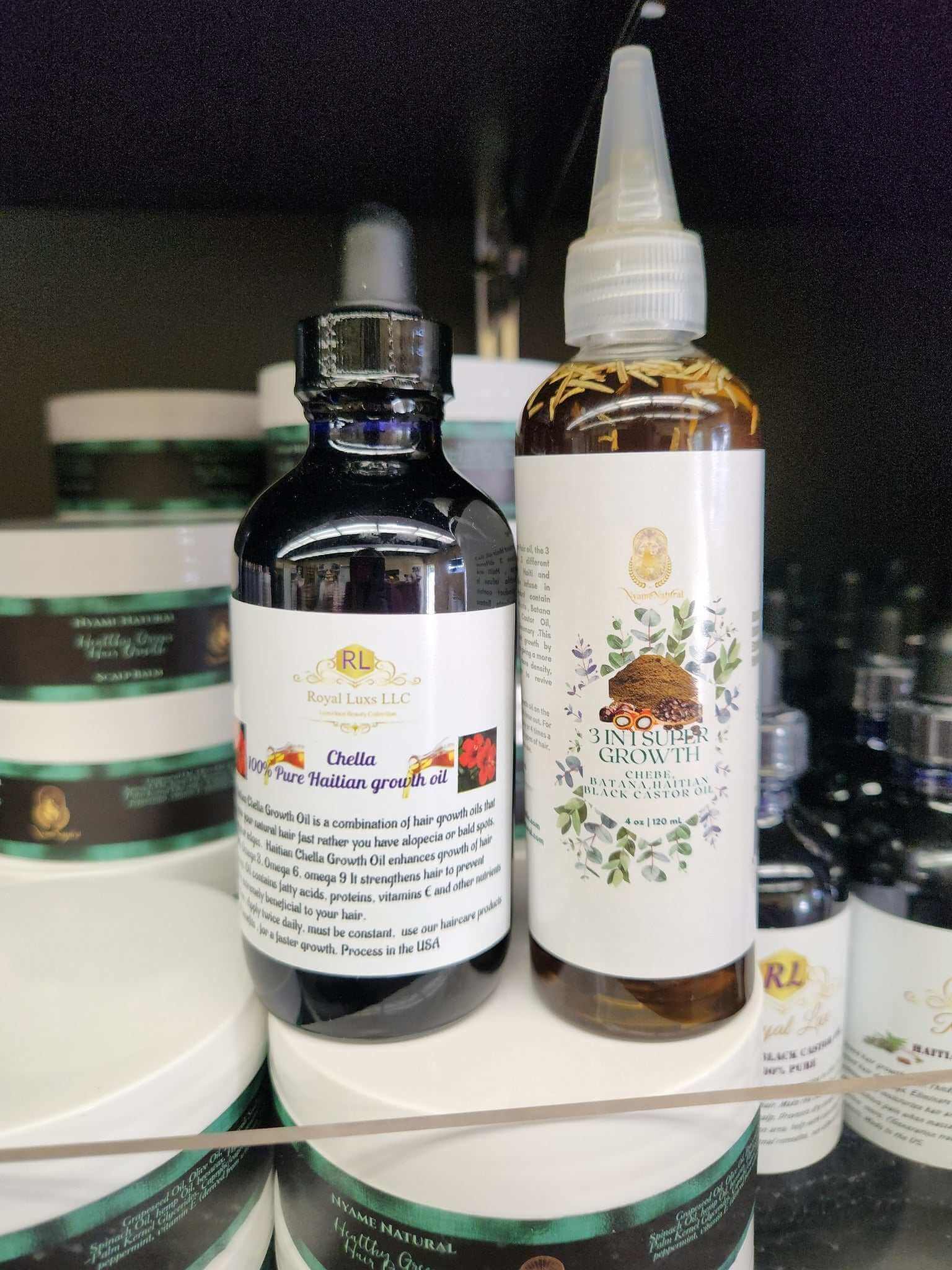 Chella Hair Growth Oil and 3 in 1 Super Growth Oil on shelf for hair care and nourishment.