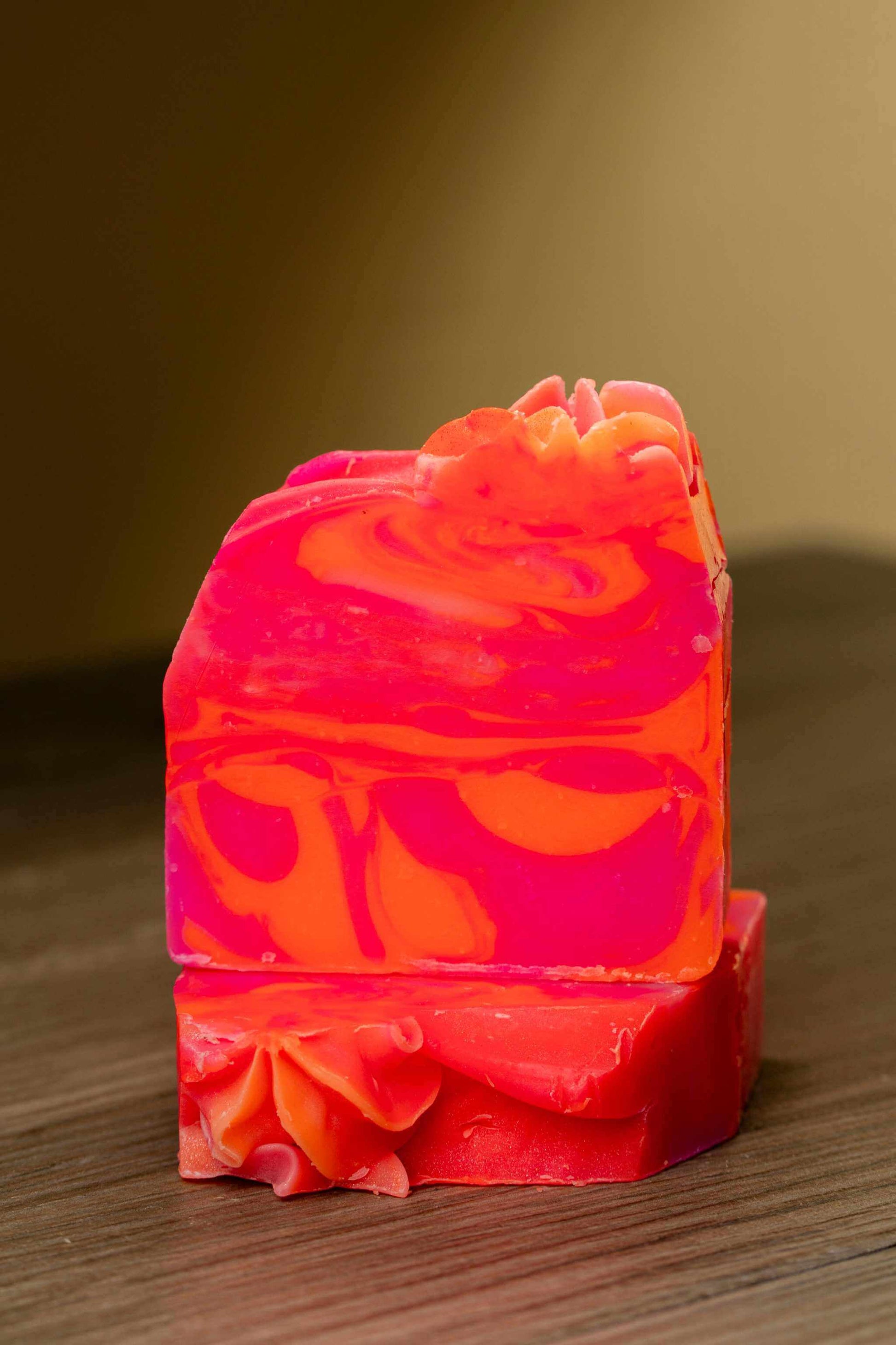 Luxurious Pink Orange Citrus Soap Bar, handmade with vibrant colors and a refreshing citrus scent.