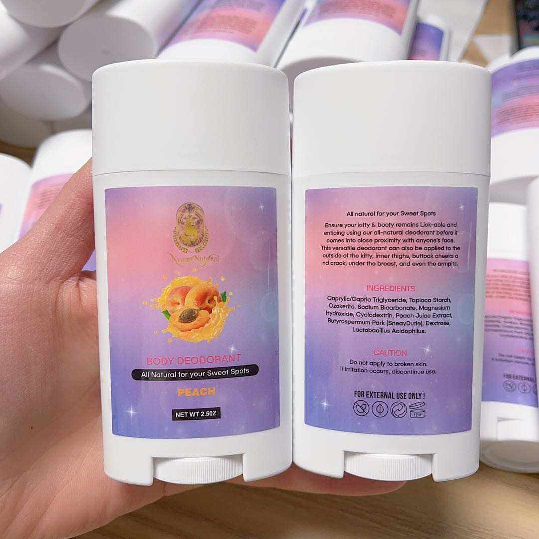 Booty Deodorant stick in peach scent, showcasing all-natural ingredients and vibrant packaging for ultimate freshness.