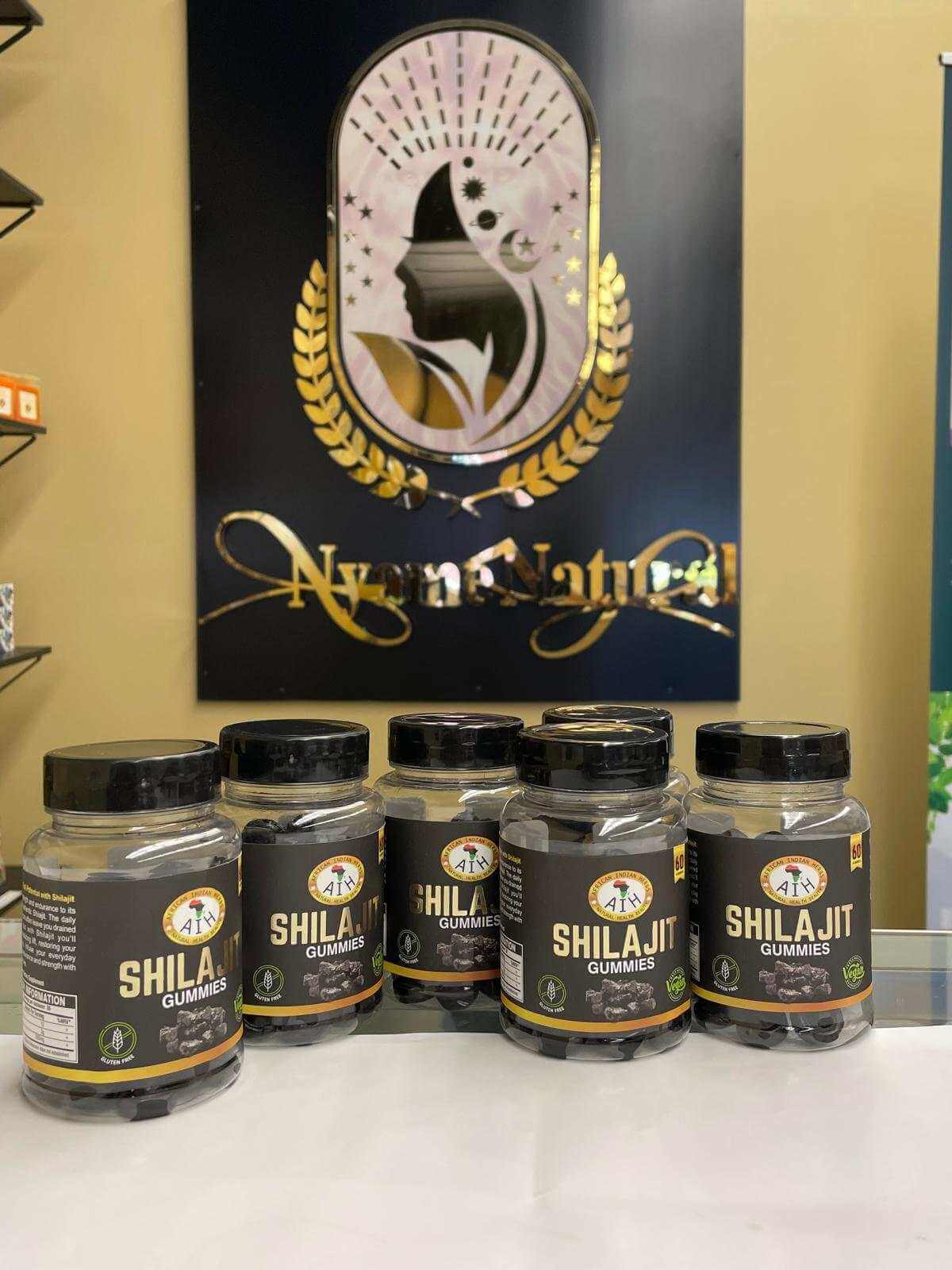 Display of AIH Shilajit Gummies jars, highlighting natural ingredients and health benefits.