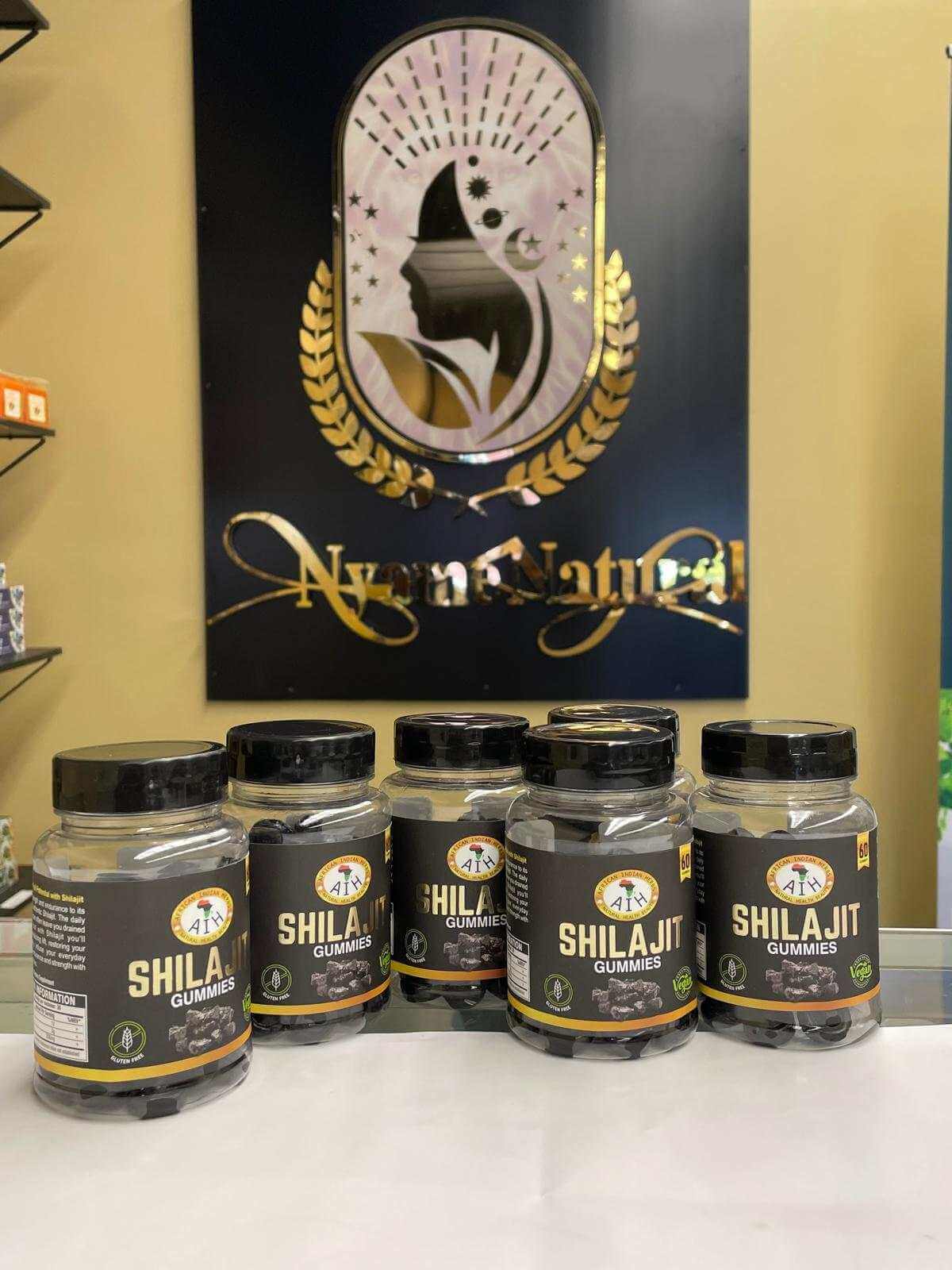 AIH Shilajit Gummies bottles displayed in a store, promoting energy and cognitive clarity.