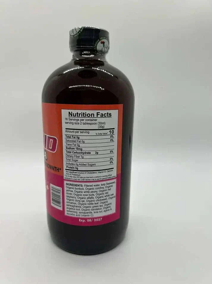 Fibroid Formula nutritional facts and ingredients on the label of a dark liquid supplement bottle.