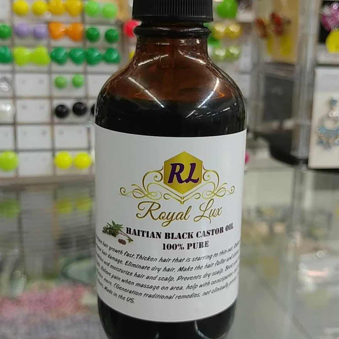 Haitian Black Castor Oil 100% Pure (4oz) bottle for thicker, healthier hair and scalp rejuvenation.