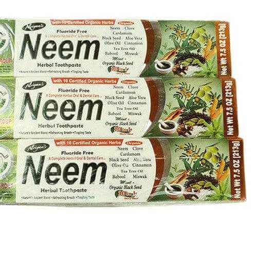 Neem Herbal 9 in 1 Toothpaste packaging showcasing natural ingredients like aloe vera and black seed for oral hygiene.