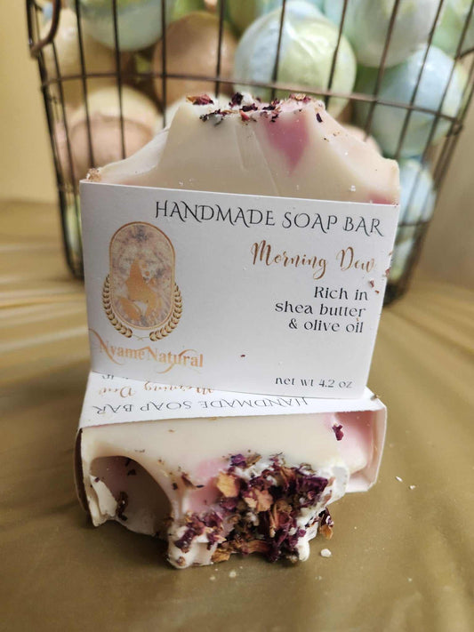 Handmade Morning Day Soap Bar rich in shea butter and olive oil, topped with floral accents, set against a pastel background.