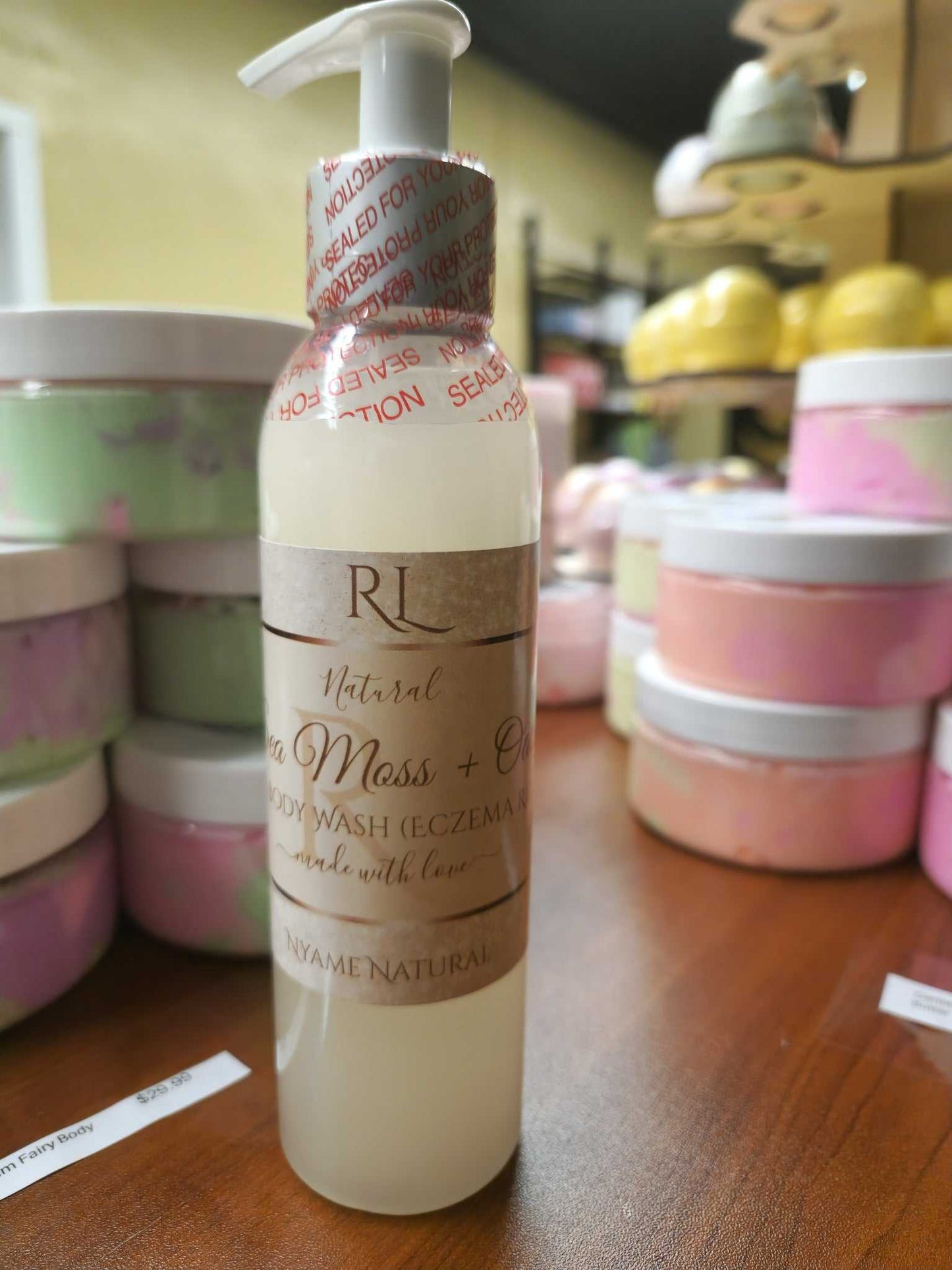 Sea Moss Face Wash with natural ingredients for eczema and dry skin, sulfate free, showcased on a wooden table.