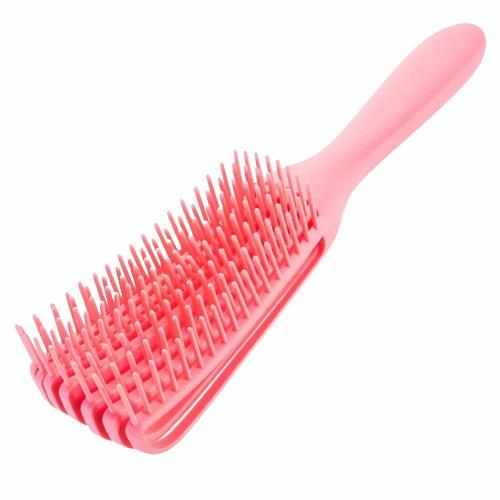 Pink detangling brush designed for effortless detangling and scalp massage, perfect for curly hair care.