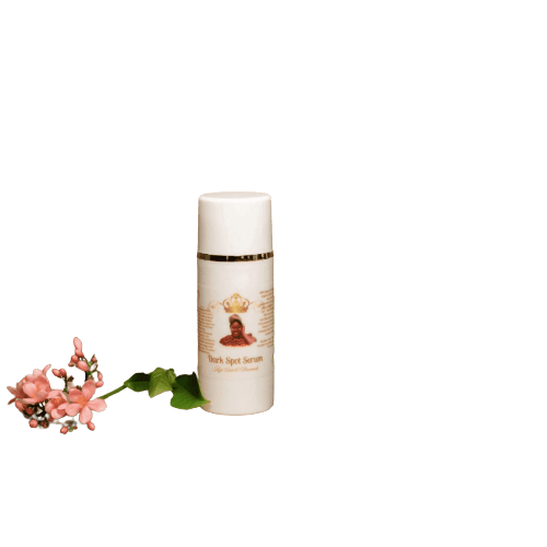 Kojic Dark Spot Serum bottle next to pink flowers, targeting dark spots for brighter skin.